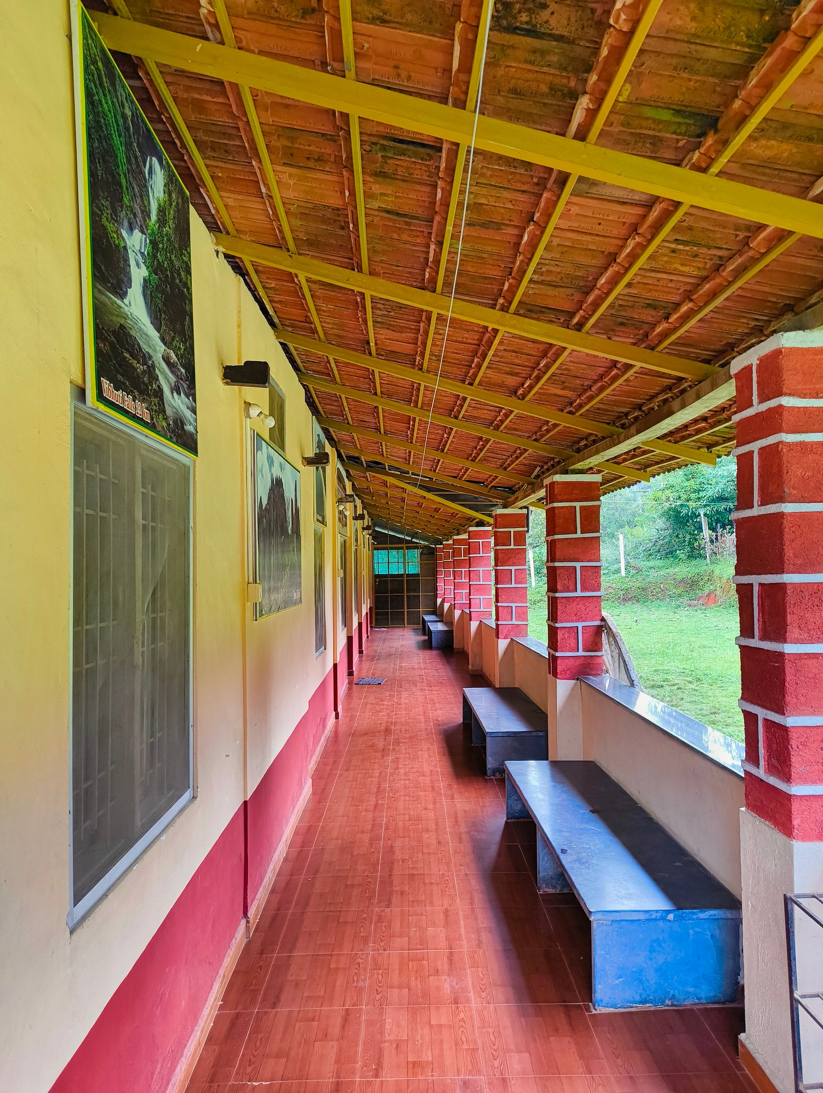 A spacious family room with multiple beds and a sofa